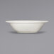 A white International Tableware stoneware bowl with a rolled edge.