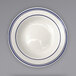 An International Tableware Danube stoneware bowl with a blue rim and bands.
