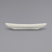 An International Tableware Roma ivory stoneware plate with a wide rolled edge on a gray surface.