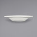 An International Tableware Athena stoneware deep rim soup bowl with a rolled edge and embossed design on a white surface.