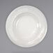An International Tableware ivory stoneware bowl with a decorative edge and a pattern on it.