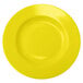 A yellow stoneware pasta bowl with a circular pattern on a white background.