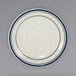 A white International Tableware Catania saucer with a blue circle and lines.