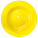 A yellow International Tableware stoneware deep rim soup bowl.