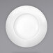 A bright white porcelain deep rim bowl with a textured pattern on the rim.