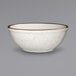 An International Tableware ivory stoneware bowl with a brown speckled rim.
