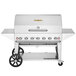 A stainless steel Crown Verity barbecue grill with wheels.