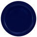 A cobalt blue stoneware plate with a rolled edge.