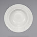 An International Tableware ivory stoneware bowl with a decorative pattern on the rim.