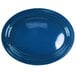 A light blue stoneware oval platter with a white surface and rim.