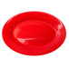 A crimson red International Tableware stoneware platter with a wide rim.
