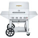 A silver Crown Verity mobile barbecue grill with wheels.