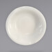 An International Tableware Valencia stoneware fruit bowl with a white rim on a white surface.
