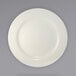 A white International Tableware stoneware plate with a wide circular rim.