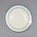 An ivory stoneware plate with blue bands on it.