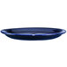 A cobalt blue stoneware platter with a narrow rim.