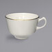 An International Tableware ivory stoneware cup with a gold rim.