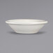 An ivory stoneware bowl with a rolled edge.
