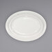 An ivory stoneware platter with a rolled edge and embossed pattern.