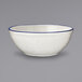 An ivory stoneware bowl with blue bands.