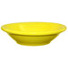 A close up of a yellow International Tableware stoneware bowl.