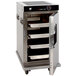 A Cres Cor stainless steel holding cabinet with trays on a metal cart.