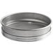 A silver Vollrath stainless steel sieve with a mesh inside.