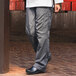 A person wearing Uncommon Chef slate gray cargo chef pants.