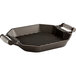 A black octagonal grill pan with metal handles.
