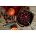 A FINEX cast iron sauce pan of cranberry sauce with oranges and cinnamon.