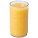 A close-up of a Carlisle clear plastic tumbler filled with orange juice.