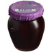 A close-up of a Dalmatia Organic Blackberry Spread jar with a purple lid.