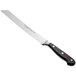 A Wusthof Classic bread knife with a black handle.