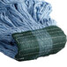 A close-up of a Carlisle blue wet mop with a green headband.