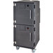 A grey plastic Cambro tall food holding cabinet on wheels with a door.