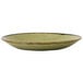 A green Dudson Harvest deep coupe plate with black speckles on the rim.