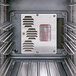 The interior of a Cambro tall profile hot food holding cabinet with a metal panel vent.