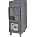 A large grey rectangular plastic Cambro Food Holding Cabinet with wheels and wires.