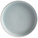 A blue porcelain deep plate with a raised white rim.