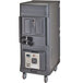A large grey rectangular Cambro food holding cabinet with wheels and wires.