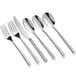 A group of Acopa Iris stainless steel salad forks.