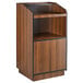 A Lancaster Table & Seating walnut podium with a shelf and doors.