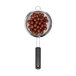 A OXO stainless steel strainer with grapes in it.