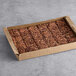 A David's Cookies box of pre-cut pecan brownies.