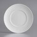 An Acopa Liana white porcelain plate with a wide rim and circular pattern.