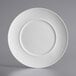 An Acopa Liana bright white porcelain plate with a circular embossed pattern.