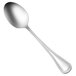 A close-up of a Oneida Barcelona stainless steel serving spoon with a silver handle.