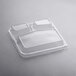 A clear plastic lid with three compartments on top of a clear plastic container.