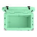 A seafoam green CaterGator outdoor cooler with the lid open.