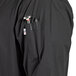 A black Uncommon Chef 3/4 sleeve chef coat with customizable black buttons and side vents.